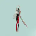 Alloy tennis badminton racket keychain bag charm with rhinestones and braided ropes. - Red & Black