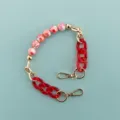 Short decorative phone case chain strap with red beads and gold hardware for daily use. - Marble Texture Resin Chain