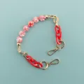 Short phone case chain with pink paw beads and red acrylic links, elegant golden hardware. - 3D Cat Paw Red Chain