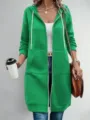 Detail view of green long hooded zip-up sweatshirt, casual everyday wear with front pockets. - Emerald Green
