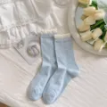Sweet women's light blue crew socks with lace ruffle cuffs and cute bow patterns for summer. - One Size / Blue