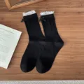 Schwarze Damensocken mit weisser Spitzenborte und süsser Schleife für den süssen Look. - Einheitsgröße / Schwarz
