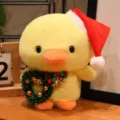 Cute yellow plush duck toy wearing a Santa hat and holding Christmas wreath for holiday decor. - Christmas Wreath Duck