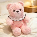 Pink plush teddy bear toy with cute white bib and bow, soft stuffed doll gift for kids. - Pink Bear / 30cm (0.45kg)