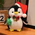 Cute Christmas penguin plush toy wearing a red santa hat and holding a tree for kids. - Christmas Tree Penguin