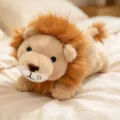 Cute plush lion toy, stuffed animal doll with fluffy mane, lying posture, soft kids companion. - Lion