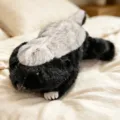 Cute stuffed animal plush toy, black and white lying design, soft companion doll. - Honey Jar
