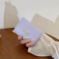 Light purple short wallet for women, cute card holder with elegant gold bowknot design. - Purple