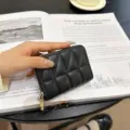 Black quilted leather card holder with zip closure, compact accordion slots for multiple cards. - Triangle Plaid-18 Cards / Black