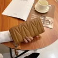 Quilted long wallet for women, zip-around design with wrist strap and metal charm detail. - W Wave - Brown