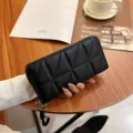 Stylish black quilted women's long wallet with zipper closure and wrist strap for daily use. - Triangle Grid - Black