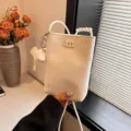 Chic white mini phone bag for women featuring cute elephant pendant and stylish crossbody strap. - Lychee Pattern - Off-White