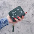 Dark green short wallet with cute cat print, zipper closure, and stylish tassel pendant. - Green