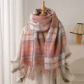 Detailed view of the cozy pink plaid fringe scarf, soft boucle cashmere texture for autumn winter. - Pink