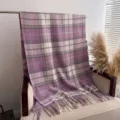 Detail view of a cozy Korean style plaid boucle cashmere-feel shawl with fringe for winter. - Purple