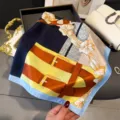 Elegant silk scarf with classic equestrian belt and bow print, stylish accessory for women. - Blue Edge