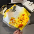 Silk-feel square scarf with artistic ginkgo leaf print, elegant neckerchief for women styling. - Yellow