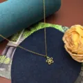 Minimalist titanium steel flower pendant clavicle chain detail view for daily wear and gifting. - Little Flower Necklace / Gold