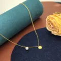 Collana in acciaio dorato con perla e ciondolo a cuore, catenina elegante e alla moda. - Collana Perla Artificiale Cuore Love / Oro