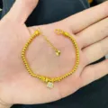 Detail shot of the golden four-leaf clover bracelet showing delicate beaded chain and pendant. - Beaded Rhinestone Clover Style (Style: 5)