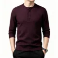 Detailed view of men waffle knit long sleeve henley shirt with textured grid pattern in burgundy. - Burgundy