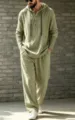 Detail view of men's casual hooded henley shirt and trousers set in sage green linen. - Army Green