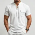 Close-up of men's linen short sleeve henley shirt with lace-up collar and chest pocket detail. - S / White