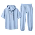 Detail view of light blue men's hooded linen short sleeve shirt and casual long pants set. - Light Blue