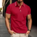 Close-up detail of men's red polo shirt featuring contrasting stripes on collar and cuffs. - S / Tops / Burgundy