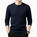 Detailed view of men's dark blue waffle knit long sleeve Henley shirt with button placket. - Navy Blue