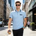 Close-up detail of men's casual polo shirt showing lapel collar and short sleeves on street. - Sky Blue