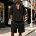 Detailed view of the men's waffle knit V-neck short sleeve top and matching shorts in black. - S / Top And Bottom / Black