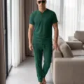 Detail shot of men's dark green waffle knit short sleeve henley shirt and lounge pants set. - Dark Green