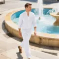 Outdoor detail view of a white cotton linen long sleeve shirt and trousers outfit. - S / Top And Bottom / White