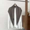 Details of the brown hollow knit triangular shawl scarf, showing exquisite openwork texture. - Dark Gray