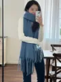 Detailed view of cozy blue mohair tassel scarf, soft winter knit texture for cold weather wear. - Haze Blue