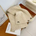 Cozy cream white cable knit winter scarf featuring cute black bow accents. Soft & warm. - Apricot