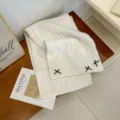 Cozy white knit winter scarf for women, featuring black bow accents, soft thick warm neck wrap. - Off White