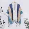 Ethnic knit cape shawl with plush fur collar and pompom tassels for cozy winter travel wear. - Sapphire Blue