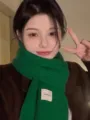 Green knitted scarf winter warm thick wool neckerchief detail view close up cozy stylish - Green