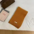 Solid color knitted wool scarf, winter warm neck warmer in caramel yellow for daily wear. - Orange
