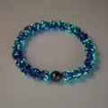 Luminous starry blue glass bead bracelet with black accent stone, glowing in dark crystal jewelry - 10mm / Sapphire Blue