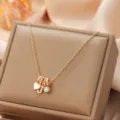 Gold-tone multi-charm pendant necklace featuring heart and letter accents for women daily wear. - Letter J
