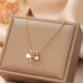 Elegant gold-tone pendant necklace featuring a cute letter charm and sparkly crystal details. - Letter C