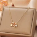Elegant gold letter D pendant necklace with crystal and heart charms for women and girls. - Letter D