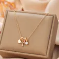 Gold-colored necklace with multi-pendant heart letter T and crystal charms for women daily wear - Letter T
