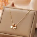 Gold-tone alloy letter L pendant necklace with heart and crystal charms for women and girls - Letter L