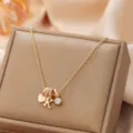 Elegant gold-tone initial K pendant necklace featuring heart charm and sparkling rhinestones. - Letter K