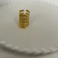 Gouden open wervelkolom ring van metaal opengewerkt breed statement mode sieraad - Goud