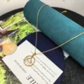 Gold stainless steel zodiac Libra pendant necklace with sparkling zirconia for women. - Libra